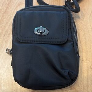 Travelon Tailored Crossbody Phone Pouch. Black with adjustable shoulder strap.